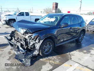2019 Mazda CX-5 Touring with VIN JM3KFACM7K1534905, listed as a IAAI auction lot 41945607 with 56,014 mi miles. Bid and sale history available at carsss.com. Image 2.
