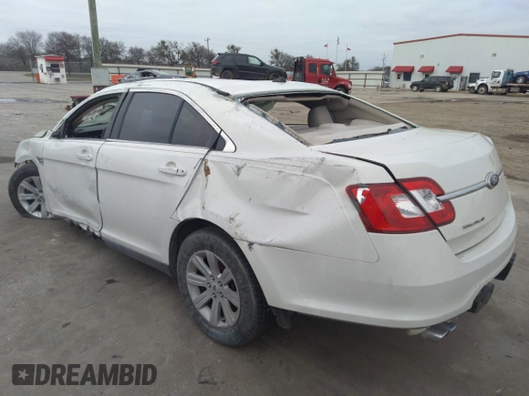 2011 Ford Taurus SE with VIN 1FAHP2DW3BG113398, listed as a IAAI auction lot 41617959 with 123,706 mi miles. Bid and sale history available at carsss.com. Image 3.