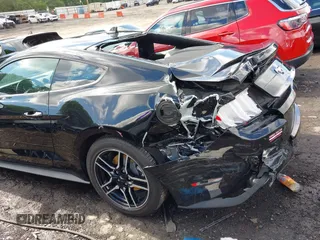 2020 Ford Mustang EcoBoost with VIN 1FA6P8TH4L5161843, listed as a IAAI auction lot 42242171 with 45,892 mi miles and . Bid and sale history available at DreamBid. Image 6.