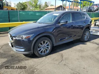 2021 Mazda CX-5 Grand Touring z VIN JM3KFBDM3M1344784, wystawiony jako Copart lot #58051445 z przebiegiem 69 593 mil mil oraz Szkoda całkowita • Salvage title. Historia ofert i sprzedaży dostępna na DreamBid. Obrazek 1.