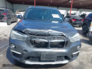 2017 BMW X1 xDrive28i with VIN WBXHT3Z33H4A65198, listed as a IAAI auction lot 41798503 with 88,951 mi miles. Bid and sale history available at carsss.com. Image 6.
