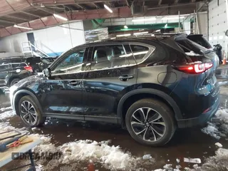 2023 Mazda CX-5 S Premium with VIN JM3KFBDM6P0100301, listed as a IAAI auction lot 41548310 with 21,722 mi miles and . Bid and sale history available at carsss.com. Image 14.
