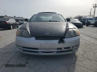 2003 Hyundai Tiburon GT z VIN KMHHN65F13U102985, wystawiony jako Copart lot #45294325 z przebiegiem 326 919 mil mil oraz Szkoda całkowita • Salvage title. Historia ofert i sprzedaży dostępna na DreamBid. Obrazek 5.