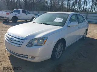 2006 Toyota Avalon XL with VIN 4T1BK36B06U080541, listed as a IAAI auction lot 41785501 with 238,569 mi miles. Bid and sale history available at carsss.com. Image 2.