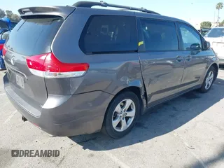2014 Toyota Sienna LE AAS with VIN 5TDKK3DC6ES521706, listed as a IAAI auction lot 41999188 with 104,867 mi miles. Bid and sale history available at carsss.com. Image 4.