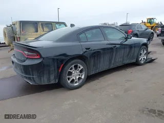 2016 Dodge Charger SXT with VIN 2C3CDXJG9GH303942, listed as a IAAI auction lot 41618893 with 116,630 mi miles. Bid and sale history available at carsss.com. Image 4.