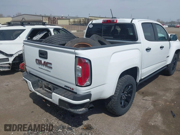 2021 GMC Canyon 4WD AT4 z VIN 1GTG6FENXM1291689, wystawiony jako IAAI lot #42038884 z przebiegiem 54 884 mil mil oraz . Historia ofert i sprzedaży dostępna na DreamBid. Obrazek 4.