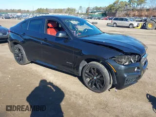 2019 BMW X6 xDrive50i with VIN 5UXKU6C59KLP60659, listed as a IAAI auction lot 41741966 with 71,487 mi miles. Bid and sale history available at carsss.com. Image 1.
