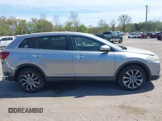 2014 Mazda CX-9 Grand Touring z VIN JM3TB3DV4E0429428, wystawiony jako IAAI lot #42094028 z przebiegiem 147 294 mil mil oraz . Historia ofert i sprzedaży dostępna na DreamBid. Obrazek 13.
