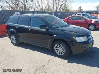 2016 Dodge Journey SXT with VIN 3C4PDDBG3GT215910, listed as a IAAI auction lot 41798779 with 165,505 mi miles. Bid and sale history available at carsss.com. Image 1.