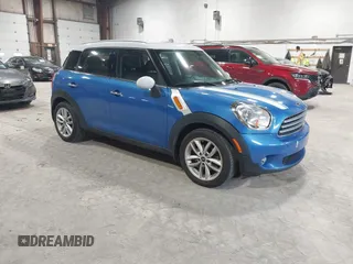 2014 MINI Countryman with VIN WMWZB3C57EWM32340, listed as a IAAI auction lot 41719482 with 129,709 mi miles and . Bid and sale history available at DreamBid. Image 1.