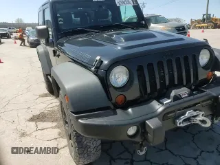 2013 Jeep Wrangler Sahara with VIN 1C4AJWBG8DL602065, listed as a Copart auction lot 52082535 with 110,727 mi miles and Salvage title. Bid and sale history available at DreamBid. Image 13.