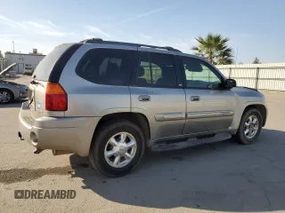 2003 GMC Envoy SLE with VIN 1GKDS13S332390989, listed as a Copart auction lot 74729104 with 127,680 mi miles and Salvage Title. Bid and sale history available at carsss.com. Image 3.