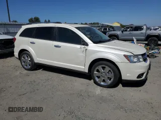 2013 Dodge Journey Crew with VIN 3C4PDCDG5DT668803, listed as a Copart auction lot 61931035 with 121,173 mi miles and Salvage title. Bid and sale history available at DreamBid. Image 4.