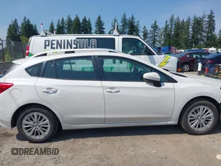 2017 Subaru Impreza Premium z VIN 4S3GTAB61H3718731, wystawiony jako IAAI lot #42520623 z przebiegiem 86 225 mil mil oraz . Historia ofert i sprzedaży dostępna na DreamBid. Obrazek 13.