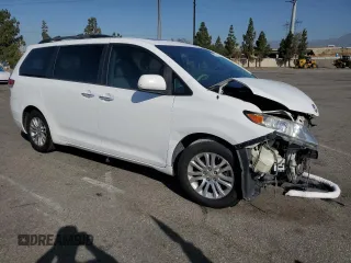 2013 Toyota Sienna XLE AAS with VIN 5TDYK3DC5DS322039, listed as a Copart auction lot 61657715 with 185,269 mi miles and Salvage title. Bid and sale history available at DreamBid. Image 4.