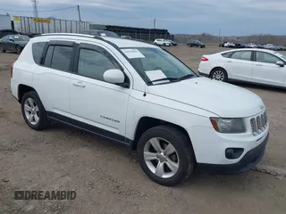 2014 Jeep Compass Latitude with VIN 1C4NJCEB5ED857185, listed as a IAAI auction lot 41919089 with 144,273 mi miles. Bid and sale history available at carsss.com. Image 1.