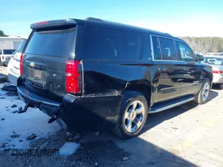 2015 Chevrolet Suburban LTZ with VIN 1GNSCKKC3FR249956, listed as a IAAI auction lot 41306605 with 122,942 mi miles and . Bid and sale history available at DreamBid. Image 4.