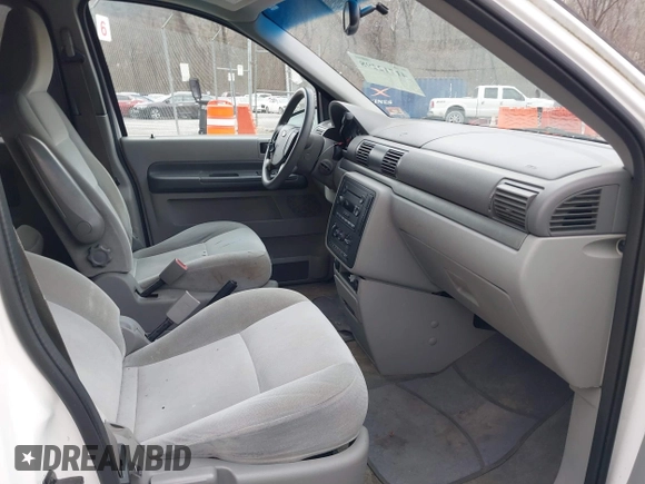 2004 Ford Freestar SES z VIN 2FMZA57604BA08613, wystawiony jako IAAI lot #41712298 z przebiegiem 183 791 mil mil oraz . Historia ofert i sprzedaży dostępna na DreamBid. Obrazek 5.
