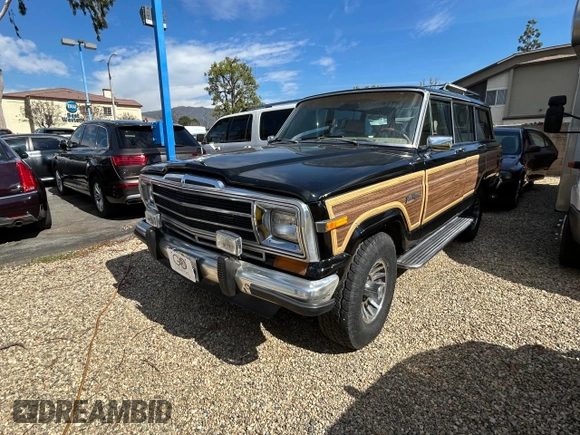 1987 Jeep Grand Wagoneer z VIN 1JCNJ15U7HT153505, wystawiony jako Copart lot #46373925 z przebiegiem 57 931 mil mil oraz Czysty tytuł • Clean title. Historia ofert i sprzedaży dostępna na DreamBid. Obrazek 2.
