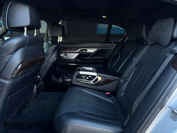 2017 BMW 7 Series 750i с VIN WBA7F0C31HGM21647, выставлен на аукционе Copart как лот 48763345 с пробегом 27 590 миль миль и Чистый • Clean title. История ставок и продаж доступна на DreamBid. Изображение 6.