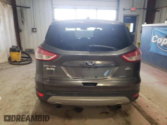 2016 Ford Escape SE z VIN 1FMCU9GX7GUA06269, wystawiony jako Copart lot #51110775 z przebiegiem 131 959 mil mil oraz Czysty tytuł • Clean title. Historia ofert i sprzedaży dostępna na DreamBid. Obrazek 6.
