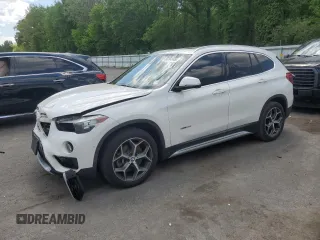 2018 BMW X1 xDrive28i with VIN WBXHT3C35J5F90062, listed as a Copart auction lot 56284945 with 138,137 mi miles and Salvage title. Bid and sale history available at DreamBid. Image 1.
