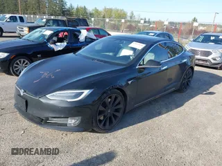 2018 Tesla Model S 75D with VIN 5YJSA1E28JF273809, listed as a IAAI auction lot 42029434 with 85,972 mi miles and . Bid and sale history available at DreamBid. Image 2.