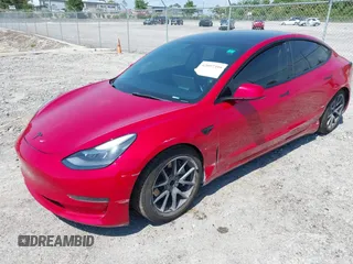 2022 Tesla Model 3 with VIN 5YJ3E1EA7NF152114, listed as a IAAI auction lot 42097399 with 96,726 mi miles. Bid and sale history available at carsss.com. Image 2.