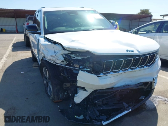 2022 Jeep Grand Cherokee with VIN 1C4RJYB66N8718018, listed as a IAAI auction lot 42002051 with Not provided miles and . Bid and sale history available at DreamBid. Image 6.