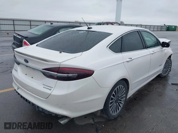 2017 Ford Fusion Hybrid Titanium с VIN 3FA6P0RUXHR317572, выставлен на аукционе IAAI как лот 42170169 с пробегом 138 987 миль миль и . История ставок и продаж доступна на DreamBid. Изображение 4.