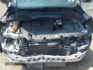 2017 Ford Escape SE z VIN 1FMCU9G95HUD37371, wystawiony jako IAAI lot #42393304 z przebiegiem 76 039 mil mil oraz . Historia ofert i sprzedaży dostępna na DreamBid. Obrazek 10.