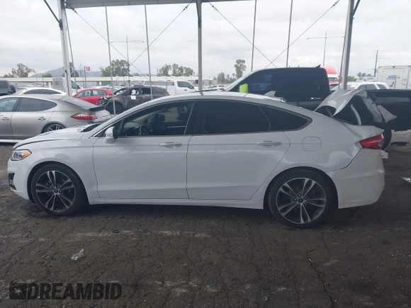 2019 Ford Fusion Titanium with VIN 3FA6P0K90KR236674, listed as a IAAI auction lot 42008633 with 99,737 mi miles and . Bid and sale history available at DreamBid. Image 14.