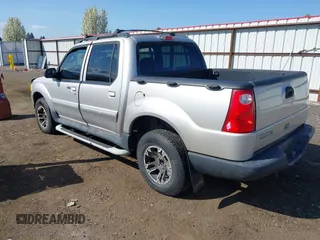 2003 Ford Explorer Sport Trac XLS z VIN 1FMZU77E63UA25807, wystawiony jako IAAI lot #42104625 z przebiegiem 230 608 mil mil oraz . Historia ofert i sprzedaży dostępna na DreamBid. Obrazek 3.