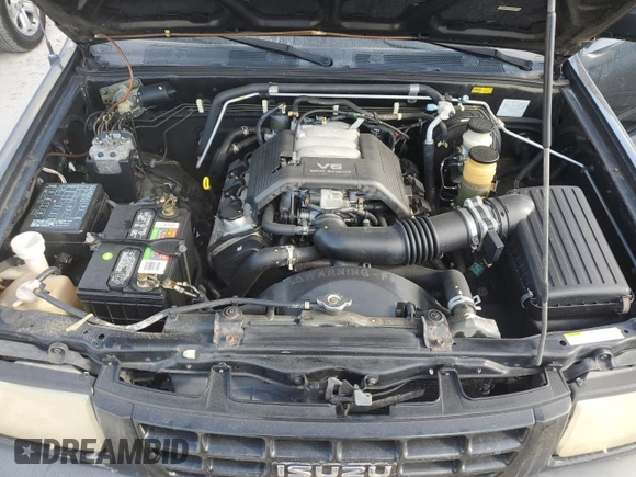 1999 Isuzu Rodeo S with VIN 4S2CK58W7X4357230, listed as a Copart auction lot 85214894 with 130,370 mi miles and Salvage title. Bid and sale history available at DreamBid. Image 12.