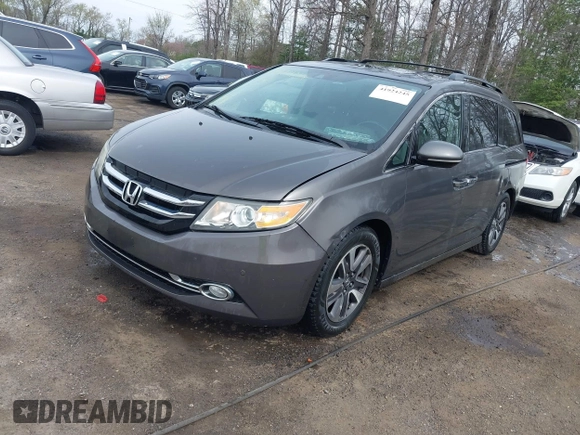 2014 Honda Odyssey Touring with VIN 5FNRL5H94EB020257, listed as a IAAI auction lot 41924245 with 204,526 mi miles and . Bid and sale history available at DreamBid. Image 2.