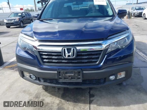 2017 Honda Ridgeline RTL-T with VIN 5FPYK2F68HB001759, listed as a IAAI auction lot 41562343 with 59,633 mi miles and . Bid and sale history available at DreamBid. Image 12.