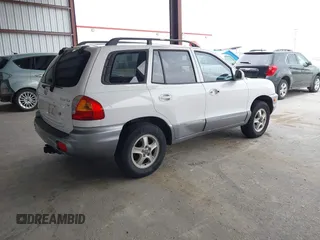 2004 Hyundai Santa Fe GLS with VIN KM8SC13D34U677767, listed as a IAAI auction lot 42054372 with 192,204 mi miles. Bid and sale history available at carsss.com. Image 4.