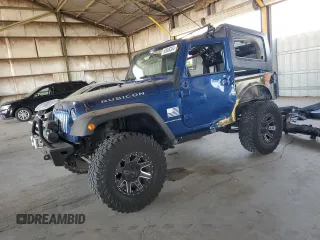 2010 Jeep Wrangler Rubicon with VIN 1J4BA6D13AL107582, listed as a Copart auction lot 65606354 with 114,418 mi miles and Salvage title. Bid and sale history available at DreamBid. Image 1.