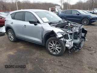 2020 Mazda CX-5 Grand Touring with VIN JM3KFBDM4L0843825, listed as a IAAI auction lot 41733575 with 18,800 mi miles. Bid and sale history available at carsss.com. Image 1.