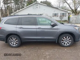 2020 Honda Pilot EX-L z VIN 5FNYF6H53LB059294, wystawiony jako IAAI lot #41910511 z przebiegiem 55 737 mil mil oraz . Historia ofert i sprzedaży dostępna na DreamBid. Obrazek 13.