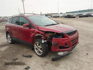 2015 Ford Escape Titanium with VIN 1FMCU9J96FUC02177, listed as a IAAI auction lot 42312928 with 100,716 mi miles and . Bid and sale history available at DreamBid. Image 1.