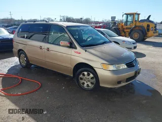 2002 Honda Odyssey EX-L z VIN 2HKRL18072H557793, wystawiony jako IAAI lot #41671403 z przebiegiem 287 403 mil mil oraz . Historia ofert i sprzedaży dostępna na DreamBid. Obrazek 1.