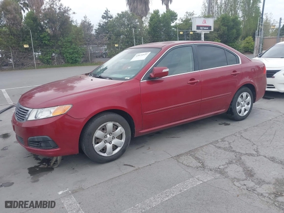 2009 Kia Optima LX with VIN KNAGE228095312766, listed as a IAAI auction lot 42074522 with 183,240 mi miles. Bid and sale history available at carsss.com. Image 2.