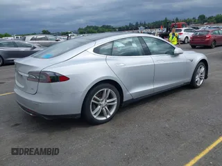 2014 Tesla Model S 60 with VIN 5YJSA1S13EFP53662, listed as a IAAI auction lot 42249930 with Not provided miles and . Bid and sale history available at DreamBid. Image 4.