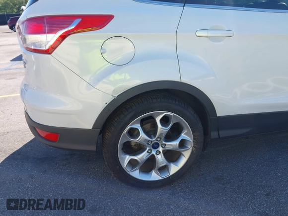 2014 Ford Escape Titanium с VIN 1FMCU0J94EUB92694, выставлен на аукционе IAAI как лот 42124647 с пробегом 107 666 миль миль и . История ставок и продаж доступна на DreamBid. Изображение 13.