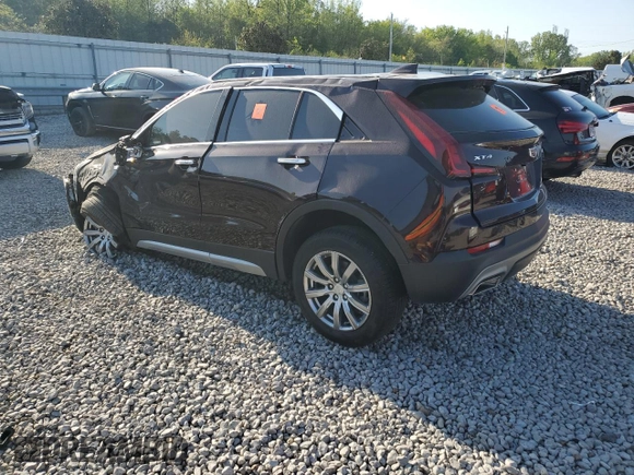2021 Cadillac XT4 FWD Premium Luxury z VIN 1GYFZCR45MF002654, wystawiony jako Copart lot #52288105 z przebiegiem Nie podano mil oraz Szkody całkowita. Historia ofert i sprzedaży dostępna na DreamBid. Obrazek 2.