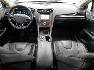 2019 Ford Fusion Titanium with VIN 3FA6P0D99KR117213, listed as a Copart auction lot 46450585 with 128,868 mi miles and Salvage Title. Bid and sale history available at carsss.com. Image 8.