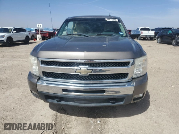 2011 Chevrolet Silverado 1500 LT with VIN 1GCRKSE33BZ332402, listed as a Copart auction lot 48675245 with 128,322 mi miles and Salvage Title. Bid and sale history available at DreamBid. Image 5.