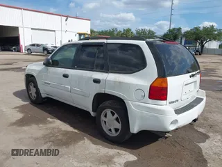2003 GMC Envoy SLT with VIN 1GKDS13S732379218, listed as a IAAI auction lot 42164368 with Not Provided miles. Bid and sale history available at carsss.com. Image 3.